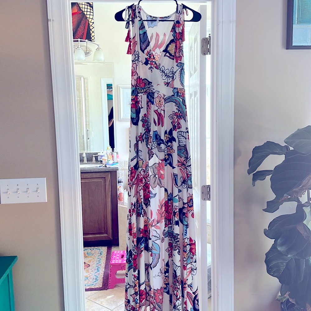 Long dress, shorts underneath never worn, size small. Floral stunning attention